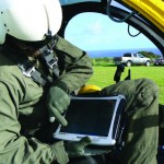 GPS-enabled field computers help pilots and crews record where they've already surveyed and where they need to go.